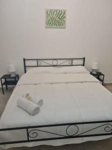 Postel nebo postele na pokoji v ubytování Fiordalisi home