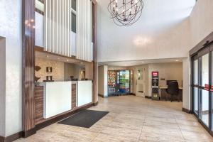 an empty lobby with a counter in a building at Comfort Inn in Burlington