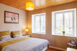 Postel nebo postele na pokoji v ubytování ARVEIL