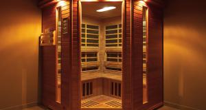 a room with a tall wooden building with lights at Villa Vitovlje in Vitovlje