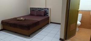 Postel nebo postele na pokoji v ubytování Arcadia Residence Plus
