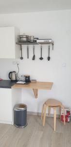 a kitchen with a wooden table and a stool at Skyview Studio-Summer Deal in Kerkini