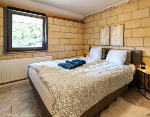 Ένα ή περισσότερα κρεβάτια σε δωμάτιο στο Millenniumhoeve (Lieke)