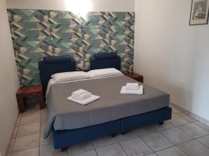 Postel nebo postele na pokoji v ubytování Agriturismo Terra dei Sassi