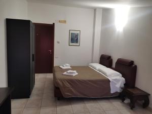 Postel nebo postele na pokoji v ubytování Agriturismo Terra dei Sassi