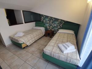 Postel nebo postele na pokoji v ubytování Agriturismo Terra dei Sassi