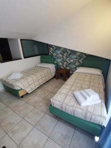 Postel nebo postele na pokoji v ubytování Agriturismo Terra dei Sassi