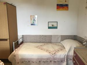 A bed or beds in a room at Casa Patrizia