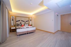 Postel nebo postele na pokoji v ubytování Downtown Sirkeci Hotel