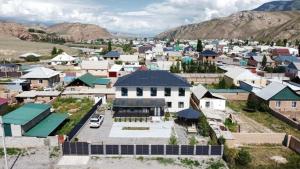 an aerial view of a small town with buildings at Kezgin Guest House in Naryn