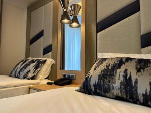 Postel nebo postele na pokoji v ubytování Downtown Sirkeci Hotel