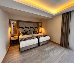 Postel nebo postele na pokoji v ubytování Downtown Sirkeci Hotel