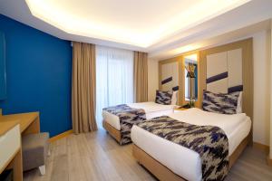 Postel nebo postele na pokoji v ubytování Downtown Sirkeci Hotel