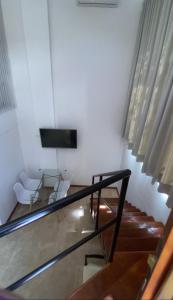 Uma TV ou centro de entretenimento em View Hotel BRC