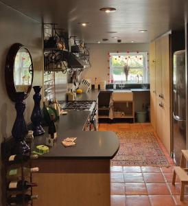 a kitchen with a stove and a counter top at Alpine Apartments Snowdonia in Betws-y-coed