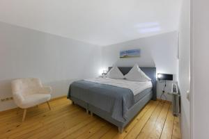 Ένα ή περισσότερα κρεβάτια σε δωμάτιο στο Leuchtturm