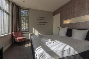 Postel nebo postele na pokoji v ubytování B&B Dennenbos