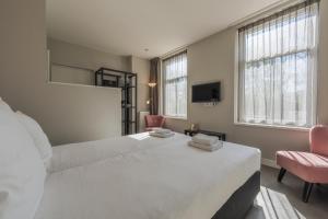 Postel nebo postele na pokoji v ubytování B&B Dennenbos