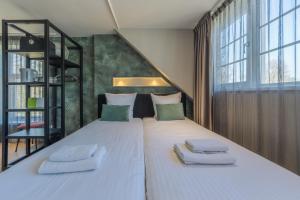 Postel nebo postele na pokoji v ubytování B&B Dennenbos