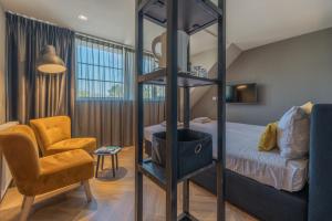 Postel nebo postele na pokoji v ubytování B&B Dennenbos