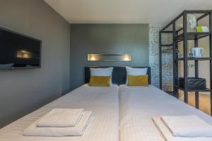 Postel nebo postele na pokoji v ubytování B&B Dennenbos