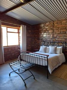 Ένα ή περισσότερα κρεβάτια σε δωμάτιο στο Die Watergat Selfcatering house