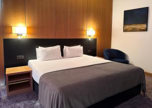 Ένα ή περισσότερα κρεβάτια σε δωμάτιο στο GAZDA Hotel&Restaurant - Self Chek-In