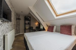 Postel nebo postele na pokoji v ubytování B&B Dennenbos
