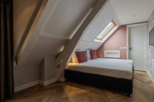 Postel nebo postele na pokoji v ubytování B&B Dennenbos