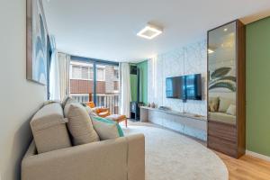 TV a/nebo společenská místnost v ubytování Charme Serrano - Lareira e Catedral a 100mt