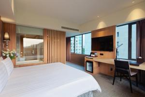 Postel nebo postele na pokoji v ubytování CHECK inn SELECT Taipei NeiHu