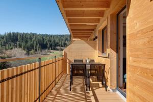 a balcony with a table and chairs on it at Gantershof in Titisee-Neustadt
