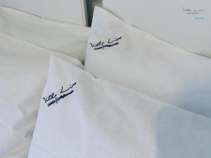 two pieces of white envelopes with writing on them at Villa Lina in Castiglioncello