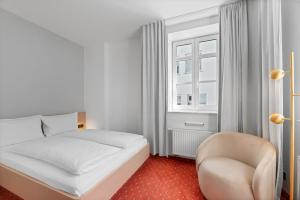 Una cama o camas en una habitación de Steiners Hotel Airport-Messe