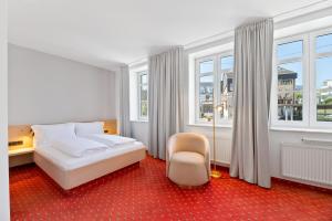 Una cama o camas en una habitación de Steiners Hotel Airport-Messe