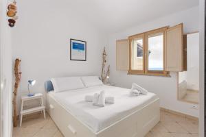 Ένα ή περισσότερα κρεβάτια σε δωμάτιο στο Sa Craba Aresti