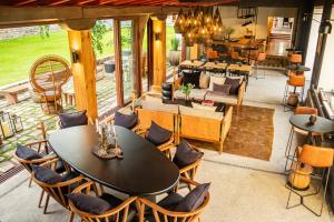 an open living room with a table and chairs at La Casona Del Banco Hotel Boutique in Parras de la Fuente