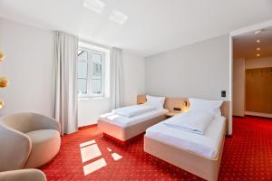 Una cama o camas en una habitación de Steiners Hotel Airport-Messe