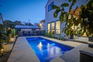a swimming pool in the backyard of a house at Maverick's Pool Paradise in San Antonio
