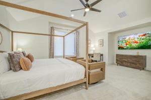 a bedroom with a bed and a large window at Maverick's Pool Paradise in San Antonio +32 photos