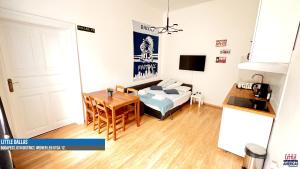 TV a/nebo společenská místnost v ubytování Little Americas Westend Apartments