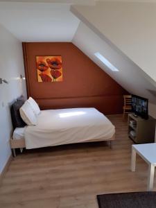 Postel nebo postele na pokoji v ubytování Guesthouse Dusart