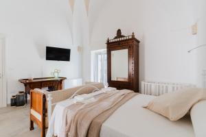 Ένα ή περισσότερα κρεβάτια σε δωμάτιο στο Dimora Jolanda a Uggiano la Chiesa