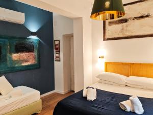 Ένα ή περισσότερα κρεβάτια σε δωμάτιο στο Roman Forum Rooms