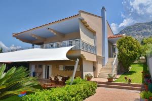 a villa with a view of the mountains at VillaSunset in Paleros +15 photos