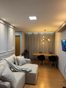 Et tv og/eller underholdning på Apartamento aconchegante