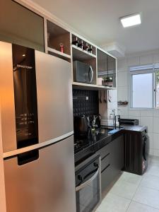 Køkken eller tekøkken på Apartamento aconchegante