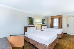 Postel nebo postele na pokoji v ubytování Coratel Inn & Suites By Jasper Wonderland