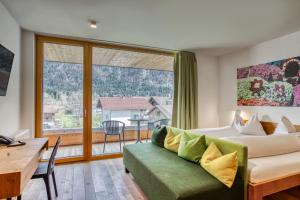 Postel nebo postele na pokoji v ubytování Hotel Wirtshaus Sattlerwirt
