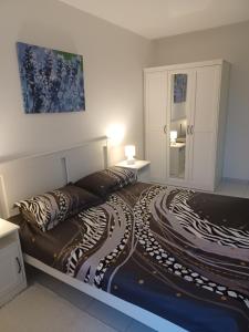 Postel nebo postele na pokoji v ubytování Apartmani Ana - Meka Draga